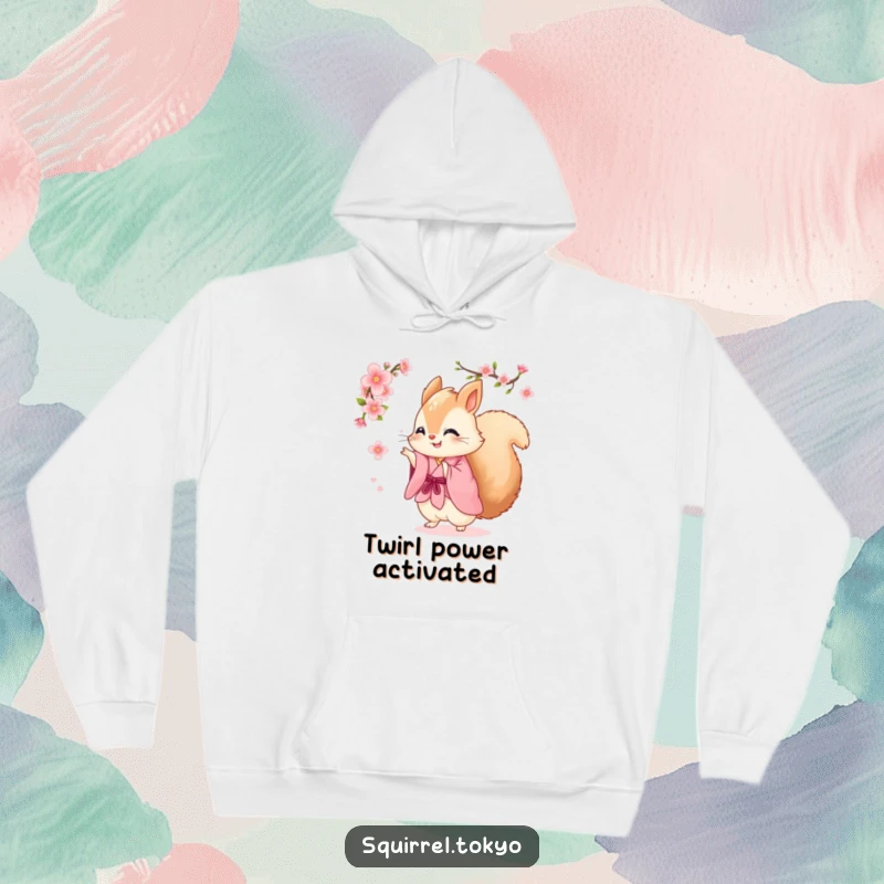Funny hoodie featuring a fluffy squirrel in a pink kimono joyfully spinning with a cherry blossom, offering comfort and cheerful humor.